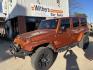 2011 Orange /Black Jeep Wrangler Unlimited Sahara 4WD (1J4BA5H12BL) with an 3.8L V6 OHV 12V engine, Auto transmission, located at 204 Hwy. 16 East, Carthage, MS, 39051, (601) 267-7277, 0.000000, 0.000000 - Photo#0