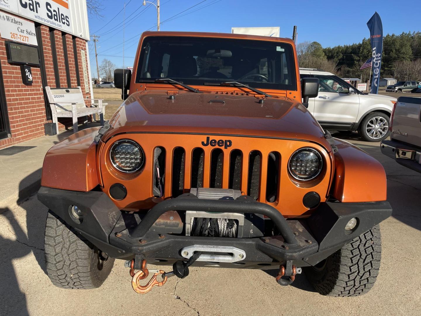 2011 Orange /Black Jeep Wrangler Unlimited Sahara 4WD (1J4BA5H12BL) with an 3.8L V6 OHV 12V engine, Auto transmission, located at 204 Hwy. 16 East, Carthage, MS, 39051, (601) 267-7277, 0.000000, 0.000000 - Photo#2