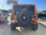 2011 Orange /Black Jeep Wrangler Unlimited Sahara 4WD (1J4BA5H12BL) with an 3.8L V6 OHV 12V engine, Auto transmission, located at 204 Hwy. 16 East, Carthage, MS, 39051, (601) 267-7277, 0.000000, 0.000000 - Photo#3