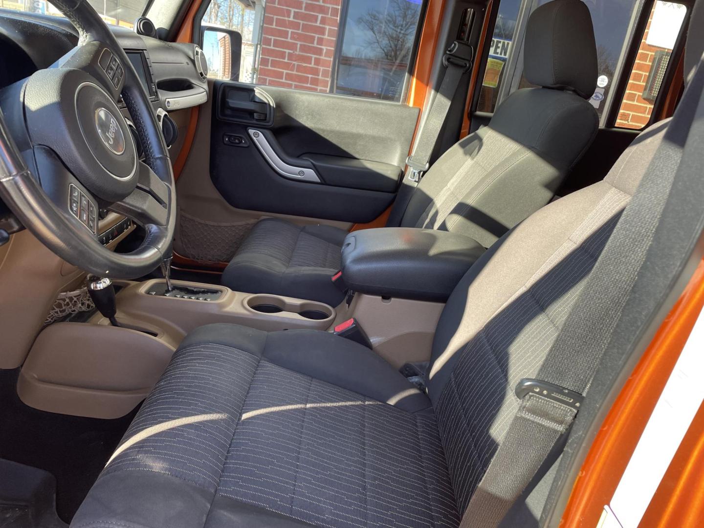 2011 Orange /Black Jeep Wrangler Unlimited Sahara 4WD (1J4BA5H12BL) with an 3.8L V6 OHV 12V engine, Auto transmission, located at 204 Hwy. 16 East, Carthage, MS, 39051, (601) 267-7277, 0.000000, 0.000000 - Photo#4